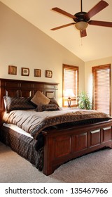 View Of Furnished Bedroom With Vaulted Ceiling And Ceiling Fan