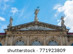 View of the gable roof of National Theater in Costa Rica downtown square with angle, beautiful blue sky and copy space for text.