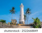 View of Galle Fort Lighthouse with a clear blue sky on a bright, sunny day in Galle, Sri Lanka