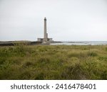 View of the Gatteville lighthouse in the Cotentin peninsula and the beach