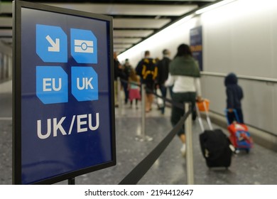 View Of A Generic UK And EU Lane Sign As Air Travellers Proceed To Border Control At An Airport 