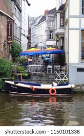View to Ghent city street, boat waiting near small city cafe. Ghent/Belgium/april 2017