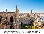 View from the Giralda Tower out over the courtyard of the Seville Cathedral with the city and Sevilla Tower Skyscraper in view.