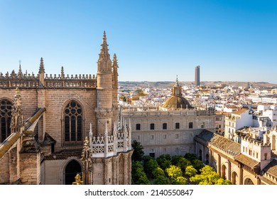 View from the Giralda Tower out over the courtyard of the Seville Cathedral with the city and Sevilla Tower Skyscraper in view.