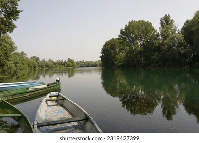 View of a glimpse of Adda River from the old landing place and from the clearing where the women washed their clothes, knows as the washer women, now stroll along the riverside. Lodi, Italy  - Powered by Shutterstock