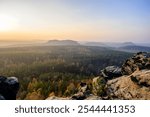 view from gohrisch in the saxon switzerland during autumn sunrise, germany