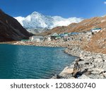 View of Gokyo lake and village with mount Cho Oyu - Gokyo trek, trek to Cho Oyu base camp and three passes trek, Gokyo valley, Sagarmatha national park, Khumbu valley, Nepal Himalayas mountains