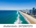 A view of the Gold Coast City behind the beach on a bright sunny day in Queensland, Australia