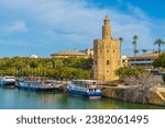 View of Golden Tower or Torre del Oro of Seville, Andalusia, Spain over river Guadalquivir 
