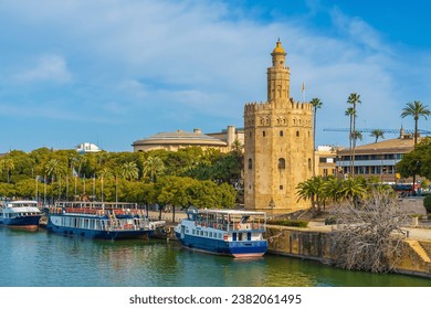 View of Golden Tower or Torre del Oro of Seville, Andalusia, Spain over river Guadalquivir 