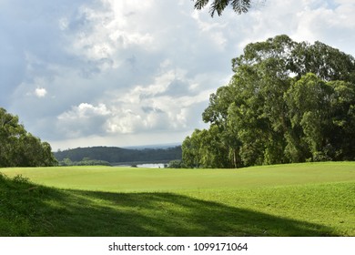 view in the golf course that can see a mountain and lake
