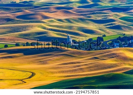 view of grain elevator and small town, Steptoe Butte, in the Palouse, a vast region in eastern Washington of mostly wheat farming.