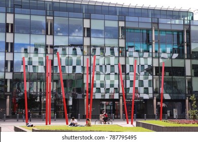 View Of The Grand Canal Theater Of Dublin Ireland Also Called The Bord Gáis Energy Theatre. Red Fine Columns Are Placed In The Ground Of The Place. The Picture Has Been Taken On 6th August 2016.