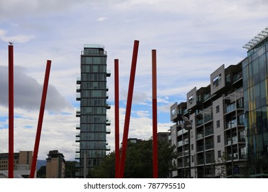 View Of The Grand Canal Theater Of Dublin Ireland Also Called The Bord Gáis Energy Theatre. Red Fine Columns Are Placed In The Ground Of The Place. The Picture Has Been Taken On 6th August 2016.