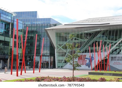 View Of The Grand Canal Theater Of Dublin Ireland Also Called The Bord Gáis Energy Theatre. Red Fine Columns Are Placed In The Ground Of The Place. The Picture Has Been Taken On 6th August 2016.