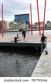 View Of The Grand Canal Theater Of Dublin Ireland Also Called The Bord Gáis Energy Theatre. Red Fine Columns Are Placed In The Ground Of The Place. The Picture Has Been Taken On 6th August 2016.