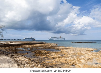 The view of Grand Cayman island Seven Mile Beach with cruise ships, replica pirate ship and a sunken ship in a background (Cayman Islands).  - Powered by Shutterstock