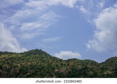 View Of Green Lushy Mountains Of Udaipur With Beautiful Sky