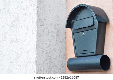 View of green mailbox on building wall - Shutterstock ID 2282616087