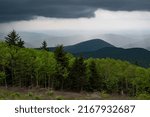 A view of the Green Mountain Nation Forest in Vermont as dark clouds bringing rain roll in.