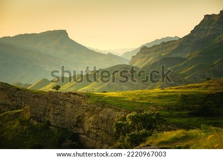 View of the green mountains at sunset. Chokh village in Dagestan, Russia. Beautiful summer landscape.