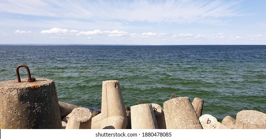 View of the greenish-blue Pucka Bay over the Hel breakwater, Poland - Shutterstock ID 1880478085
