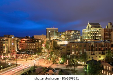 A view of Greenville, South Carolina illuminated at night in the blue hour.