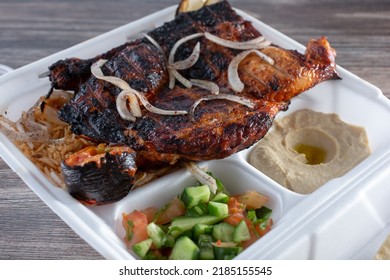 A View Of A Grilled Half Chicken Plate.