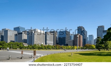 View of the group of high rise building in Marunouchi area, one of the major business district in tokyo, observed from the garden in front of the imperial tokyo palace.
