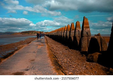 A view of a group of tourists walking in Cramond Island, Scotland