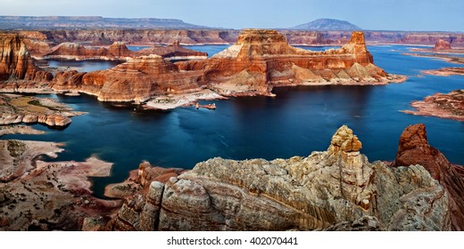 View of Gunsight Butte surrounded by Lake Powell, taken from Romana Mesa, near Alstrom Point, Glen Canyon National Recreation Area of Utah. Taken after the sunset during the horizon's glow.