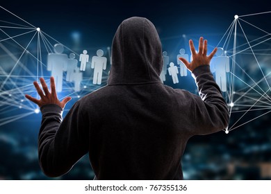 View of a Hacker man in the dark using computer to hack data and information system