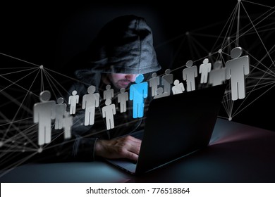 View of a Hacker man in the dark using computer to hack data and information system
