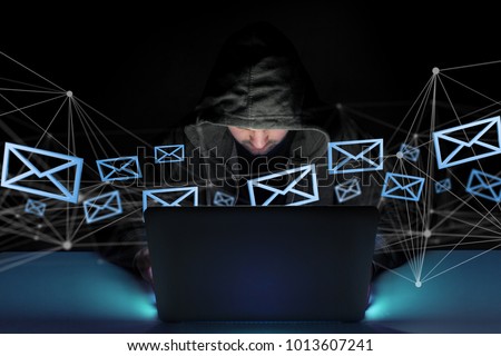 View of a Hacker man in the dark using computer to hack data and information system