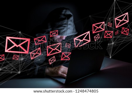 View of a Hacker man in the dark using computer to hack data and information system