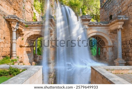 View of Hadrian's Gate with upper duden waterfall in old city of Antalya, Turkey