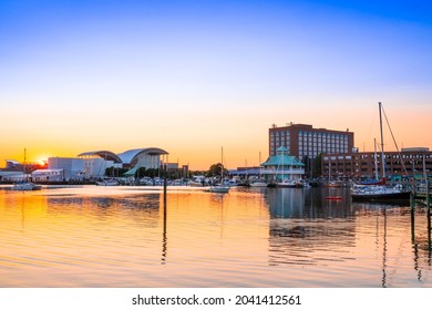 View of Hampton Virginia downtown waterfront district seen at sunset under colorful sky