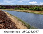 View of Hanapepe River from entrance to Hanapepe Swinging Bridge, Kauai, Hawaii on a sunny day, no people