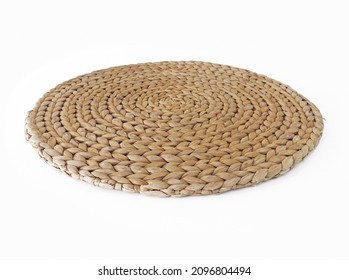 View of handmade round beige wicker tablecloth surface isolated on white background; Close-up of single oval water mat of water hyacinth fabric. Rustic decoration. Environmentally friendly. Household. - Shutterstock ID 2096804494