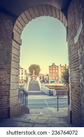 View Of Hapenny Bridge From Merchants Arch In Dublin, Ireland