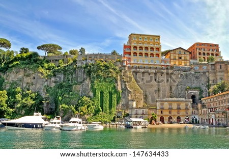 View of the harbor and cliffs of Sorrento with various historic buildings