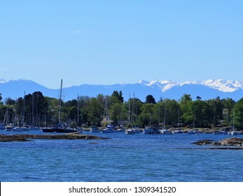 View of Harbor and Olympic National Park, Washington state, in Victoria, Vancouver Island, British Columbia, Canada