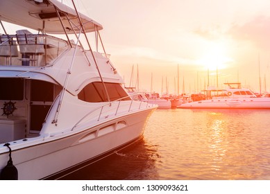 View of harbor with yachts details. Beautiful sunset sky in the marina bay. Background