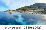 View to harbour and old town of Giglio Porto at Isola del Giglio, island of the tuscan archipelago, beautiful ancient rustico buildings and ferry terminal to Porto San Stefano, Grosseto Tuscany Italy