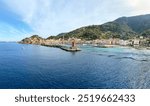 View to harbour and old town of Giglio Porto at Isola del Giglio, island of the tuscan archipelago, beautiful ancient rustico buildings and ferry terminal to Porto San Stefano, Grosseto Tuscany Italy