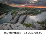 View of Harpers ferry from overlook point at Maryland Height trails during a sunset period