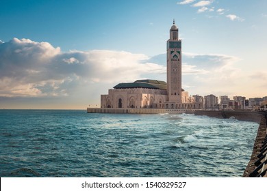view of Hassan II mosque between sky and water