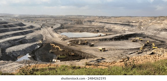 view of heavy equipment working in a coal mine 