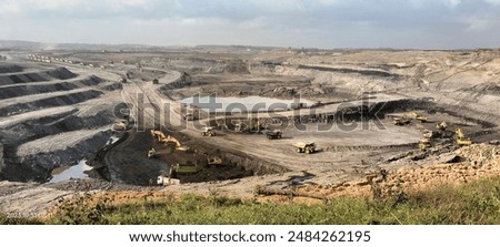 view of heavy equipment working in a coal mine 