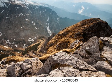 View of the high mountains with rocks on the foreground. Last rays of the sun in tatras - Shutterstock ID 156983543